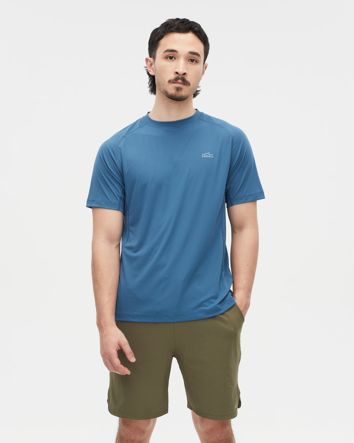 Kelly wearing the Tasman Blue top, size M