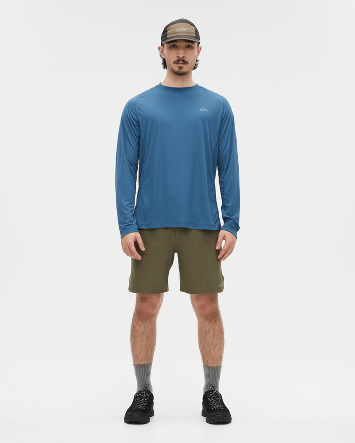 Kelly wearing the Tasman Blue top, size L