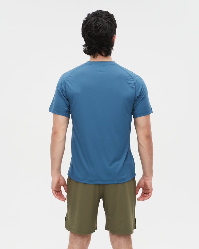 Kelly wearing the Tasman Blue top, size M
