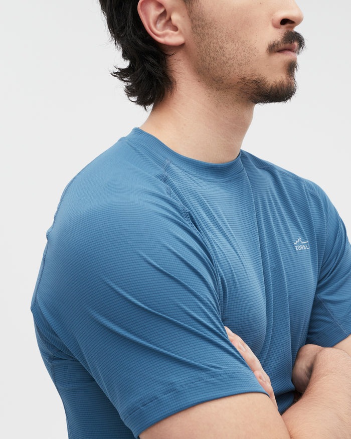 Kelly wearing the Tasman Blue top, size M