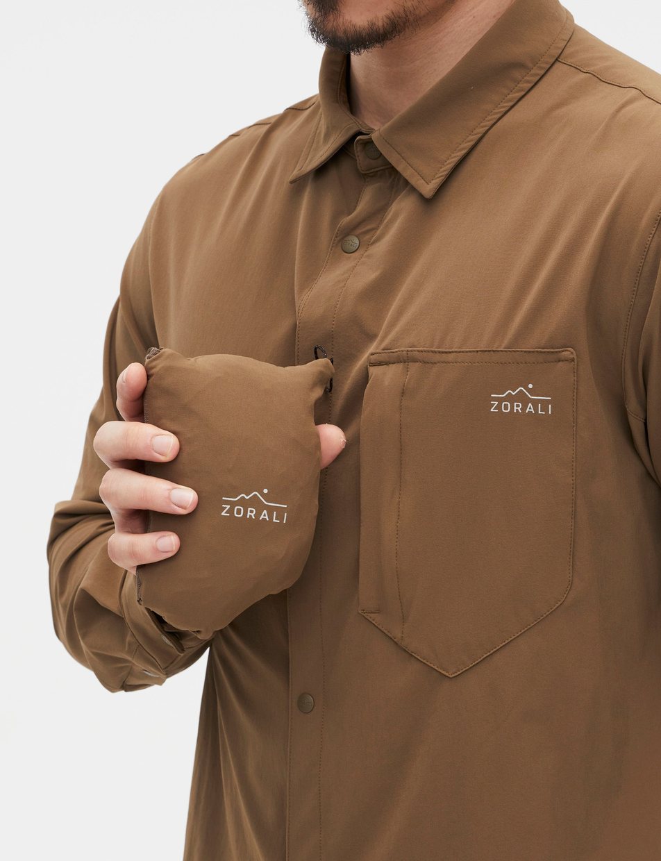 Shirt packed into its own chest pocket