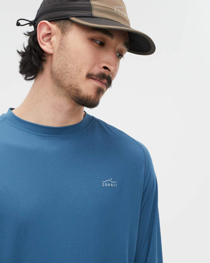 Kelly wearing the Tasman Blue top, size L