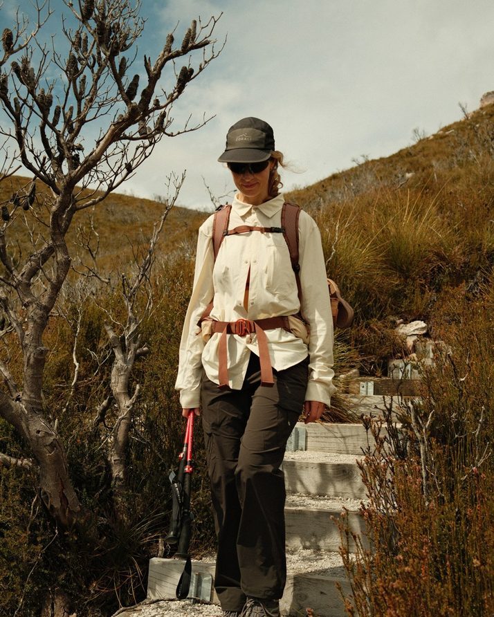 Elise climbing stone steps in the Beachwood Daylight™ Technical Long Sleeve Shirt