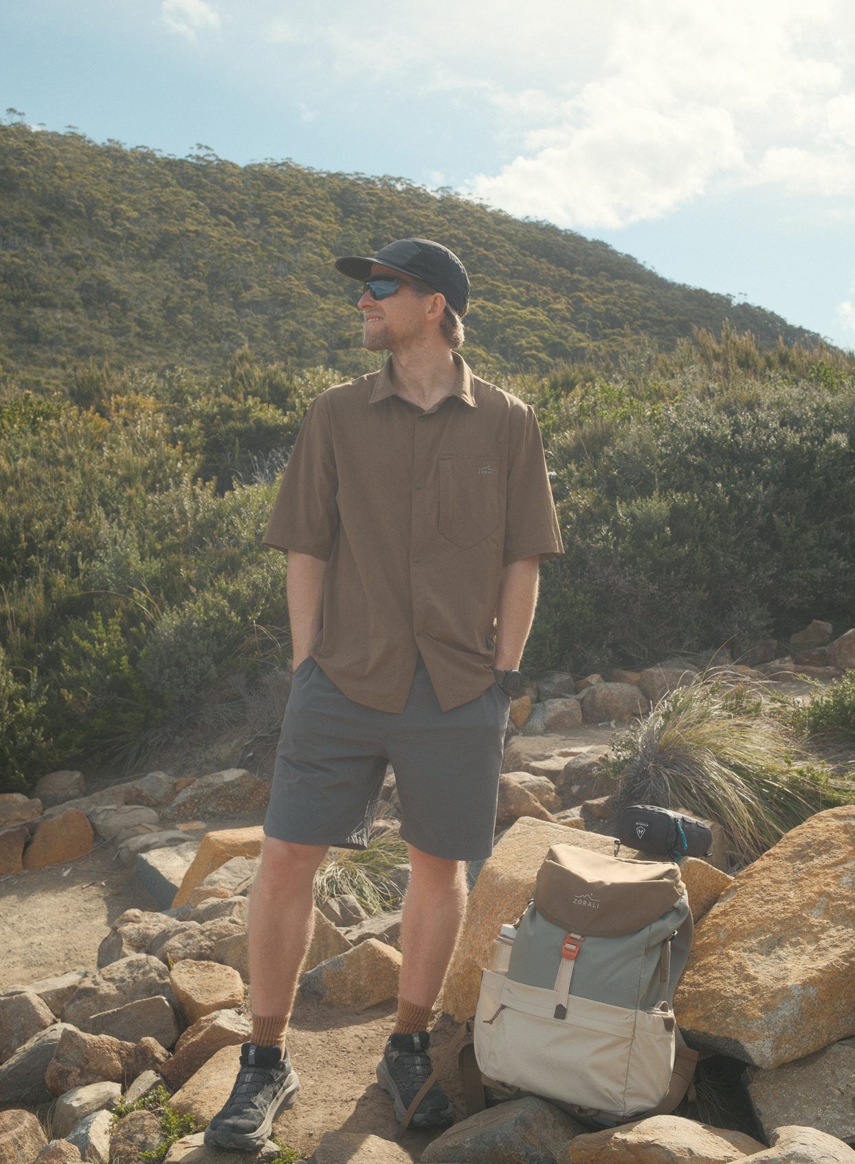 Cam on a rocky coastal track in Daylight™ Shorts in Ash