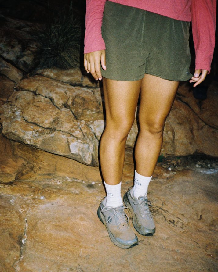 Daylight™ Shorts in Ivy Green on a hiker standing on wet rock