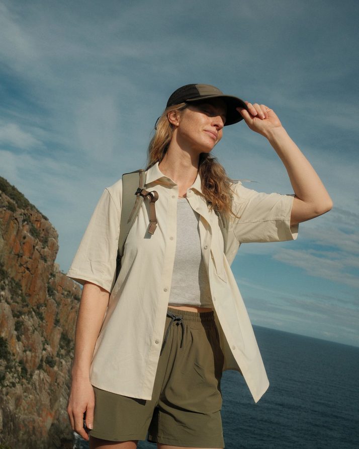 Elise on the Three Capes sea cliffs in Daylight™ Shorts in Ivy Green