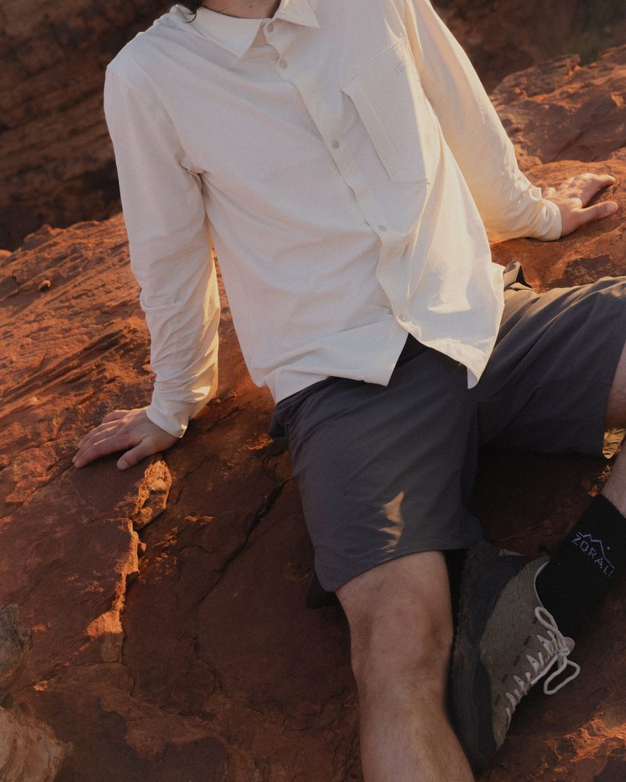 Daylight shirt, seated on rock