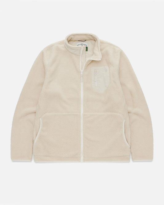 Cream sherpa fleece jacket laid flat, showing the zip front, chest pocket, and Cosy Camp Fleece woven label at the collar.