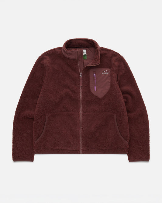 Maroon sherpa fleece jacket laid flat, showing the zip front, chest pocket with purple zipper pull, and Cosy Camp Fleece woven label.