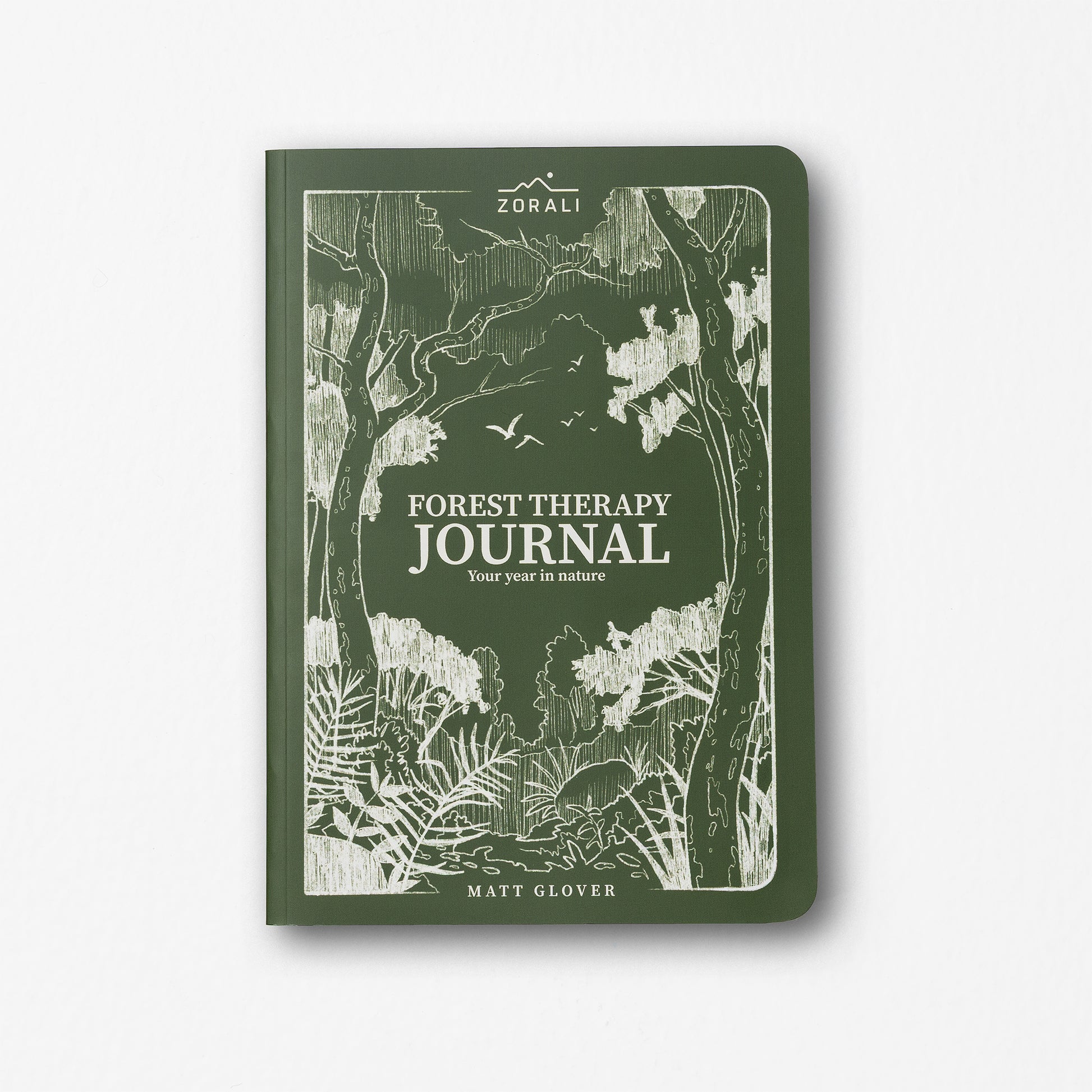 Green journal with forest design and 'Forest Therapy Journal' text on a white background