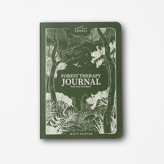 Green journal with forest design and 'Forest Therapy Journal' text on a white background