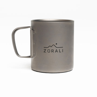 Gray mug with 'Zorali' logo on a white background