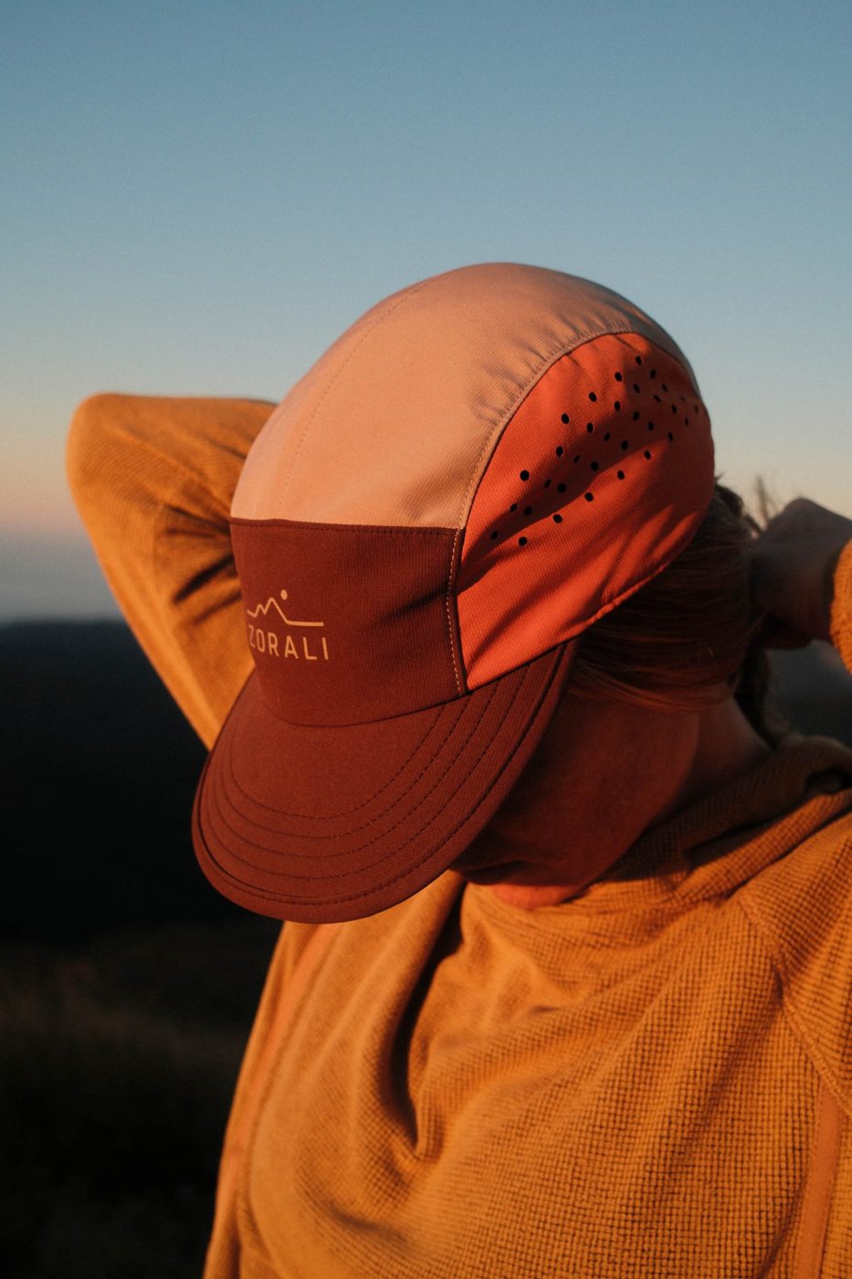 Air-Trek Cap in Coffee Spice at sunset, perforated side panel