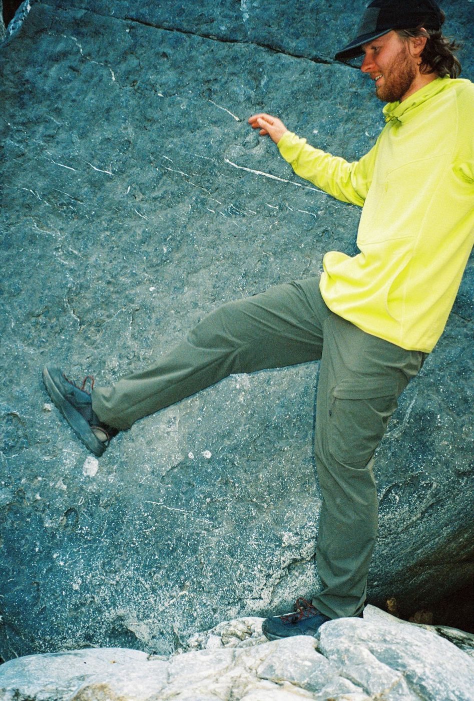 A high step onto a boulder in Overland Pants, Forest Night