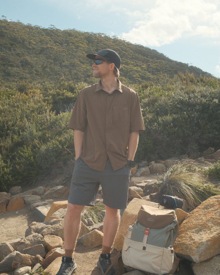 Cam on a rocky coastal track in Daylight™ Shorts in Ash