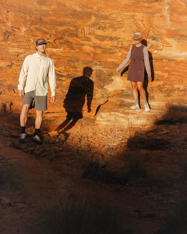 Two hikers and their shadows on a sunlit rock wall at Kings Canyon, one in Daylight™ Shorts