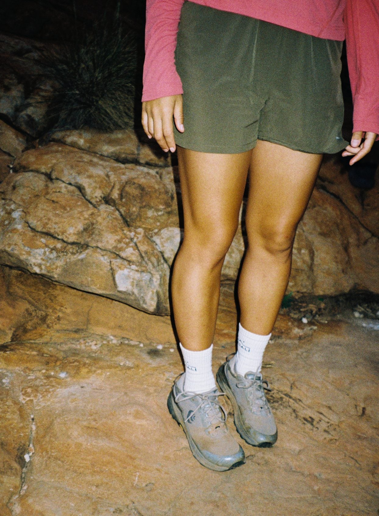 Daylight™ Shorts in Ivy Green on a hiker standing on wet rock